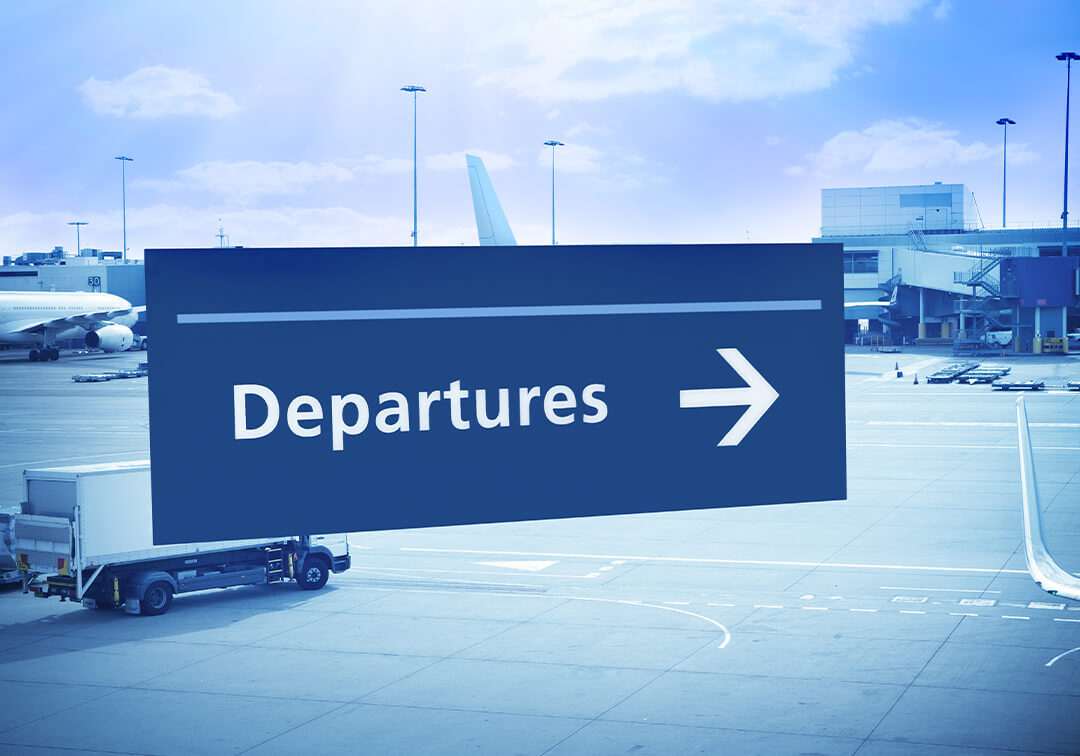 departures sign with an arrow pointing to the right